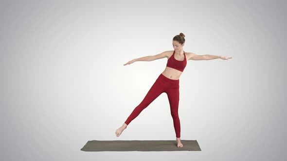Woman Practicing Yoga, Standing in Extended Side Angle Exercise, Utthita Parsvakonasana Pose on