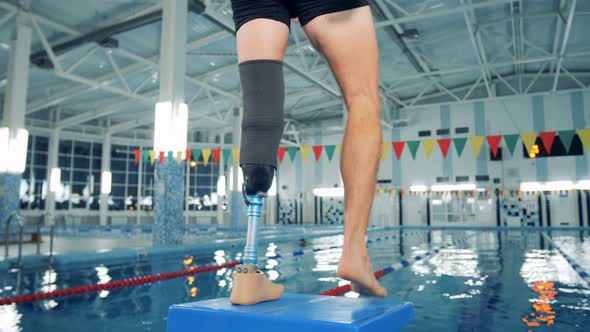 Disabled Man Training at a Pool, Bionic Leg Prosthesis