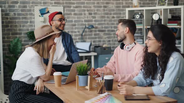 Group of Men and Women Having Conversation Laughing During Business Meeting