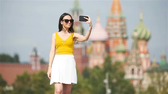 Happy Young Urban Woman in European City.