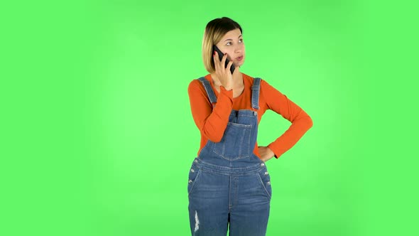 Girl Angrily Speaks on the Phone, Proves Something. Green Screen