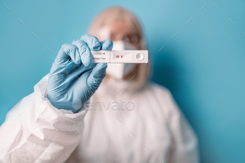 s Covid-19 rapid antigen test on blue background