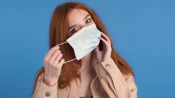 Redhaired Woman in Beige Jacket