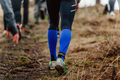 runner legs in compression socks walking on dirty trail - PhotoDune Item for Sale