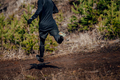 male runner run down mountain in muddy trail - PhotoDune Item for Sale