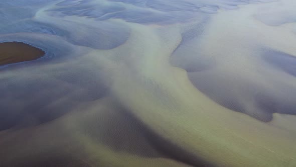 Abstract Aerial View Of Blue Olfusa River During Winter In Southern Iceland.