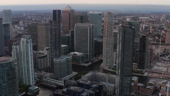 Aerial Slide and Pan Footage of Modern Business Urban District Canary Wharf with Group of Tall