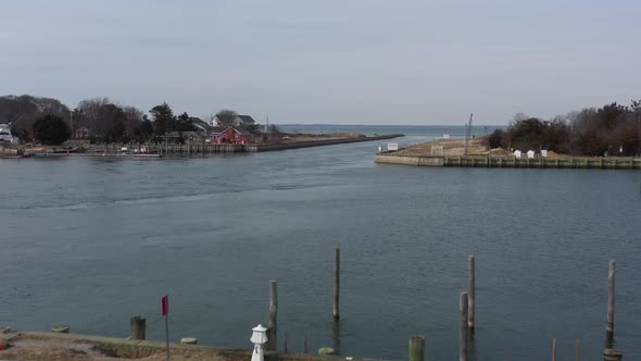 A low angle view of the Shinnecock Canal in Hampton Bays, Long Island, NY. The drone camera dolly in