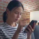 woman using smartphone and showing signs of joy with celebrating success. - VideoHive Item for Sale