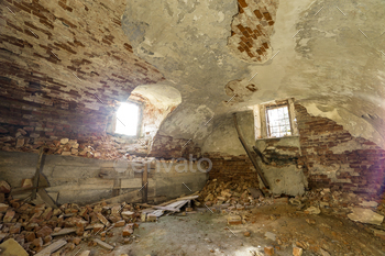 ng or palace with cracked plastered brick walls, low arched ceiling, small windows with iron bars and dirty floor.