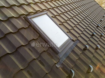 shingled house roof. Professionally done building and construction work, roofing and installation concept.
