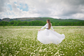 Young woman in chamomile flowers - PhotoDune Item for Sale