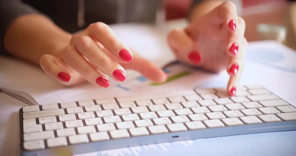 Hands of Secretary with Red Manicure Typing on Computer Keyboard Closeup  Movie