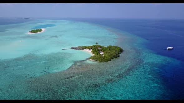 Aerial above scenery of beautiful seashore beach trip by blue sea and clean sand background of a day