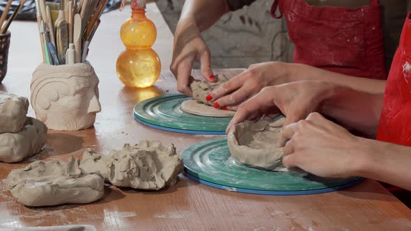 Professional Potters Working with Clay at the Ceramics Studio