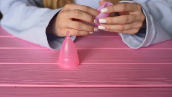 Close Up Menstrual Cup Latex Silicone Girl Looking Holding Hands Compress Folding