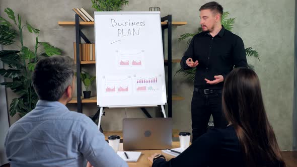 Businessman tells presentation business strategy plan achieving targets