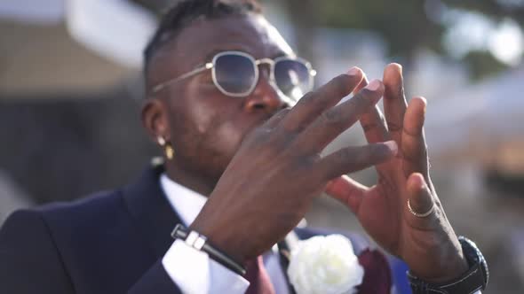 Closeup Hands of Desperate Troubled Blurred African American Man Talking Complaining in Sunlight