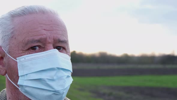 Grandpa in a Medical Mask in the Open Air