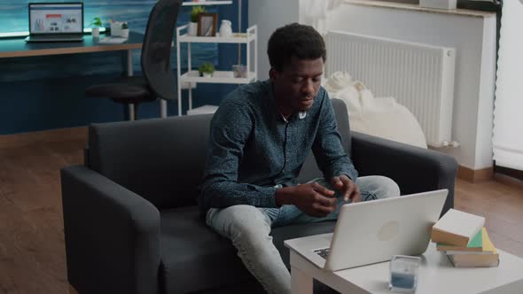 African American Entrepreneur on Remote Video Call From His Living Room