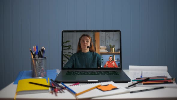 A Young Man is Talking on a Video Call with a Young Woman