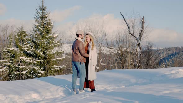 Couple in Winter on the Mountain