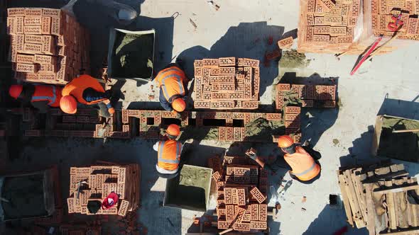 Aerial Top View of Builders Building a House