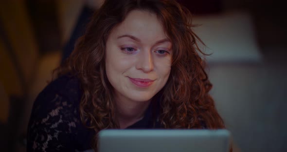 Woman Doing Online Shopping on Digital Tablet Browsing Social Media