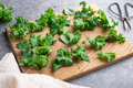 Fresh green kale cabbage leaf on a wooden cooking board - PhotoDune Item for Sale