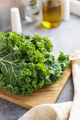 Fresh green kale cabbage leaf on a wooden cooking board - PhotoDune Item for Sale