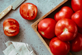 Fresh ripe red tomatoes in wooden box on a cooking table - PhotoDune Item for Sale