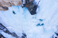 Man is leading on Ice. Ice Climbing on Frozen Waterfall, Aerial View. Barskoon Valley, Kyrgyzstan - PhotoDune Item for Sale