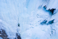 Man is leading on Ice. Ice Climbing on Frozen Waterfall, Aerial View. Barskoon Valley, Kyrgyzstan - PhotoDune Item for Sale
