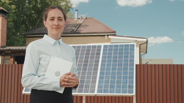 Woman Posing Before Solar Panels