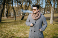 Confident young bearded male in sunglasses vape electronic cigarette. A young handsome bearded - PhotoDune Item for Sale