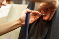Professional hairdresser dyeing hair of her client in salon. Haircutter cuting hair. Selective focus - PhotoDune Item for Sale