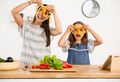 Shot of a mother and daughter having fun in the kitchen - PhotoDune Item for Sale