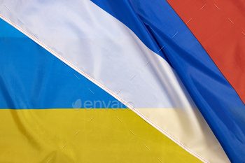 Close-up on ukrain and russian flag
