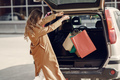 Woman by the car with a shopping bags - PhotoDune Item for Sale