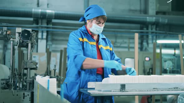 Female Worker Separating Paper Napkins at a Paper Factory