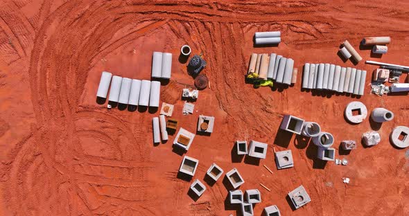 Aerial View Stacked Pipe at Concrete Drainage Pipes for Building with Preparation Land for