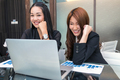 Portrait of Two Asian young Businesswoman sitting and using the technology laptop - PhotoDune Item for Sale