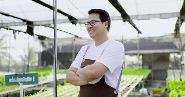 Asian young farmer man cross arms and laughing with happy