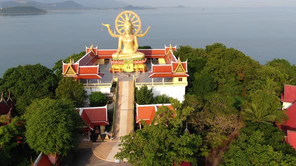 Thailand landmark. Aerial view of golden big Buddha temple