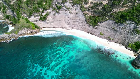 Aerial drone video of Diamond Beach in Nusa Penida Bali during the day