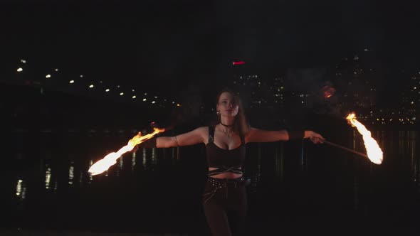 Lovely Firegirl Performing Art of Fire at Night City