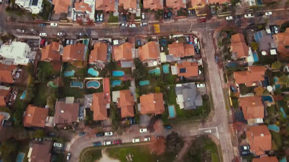 Aerial at high speed over orange roofs of neighbourhood houses-4K