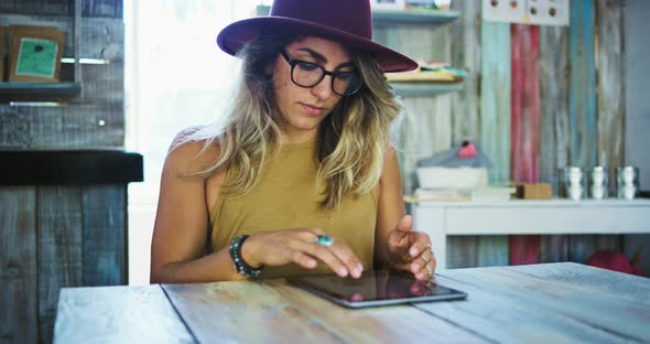 Woman Using Smartphone in Cafe