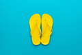 Yellow Beach Flip-Flops on The Blue Background - PhotoDune Item for Sale