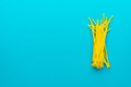 Top View of Yellow Drinking Straws Over Turquoise Blue Background and Copy Space - PhotoDune Item for Sale